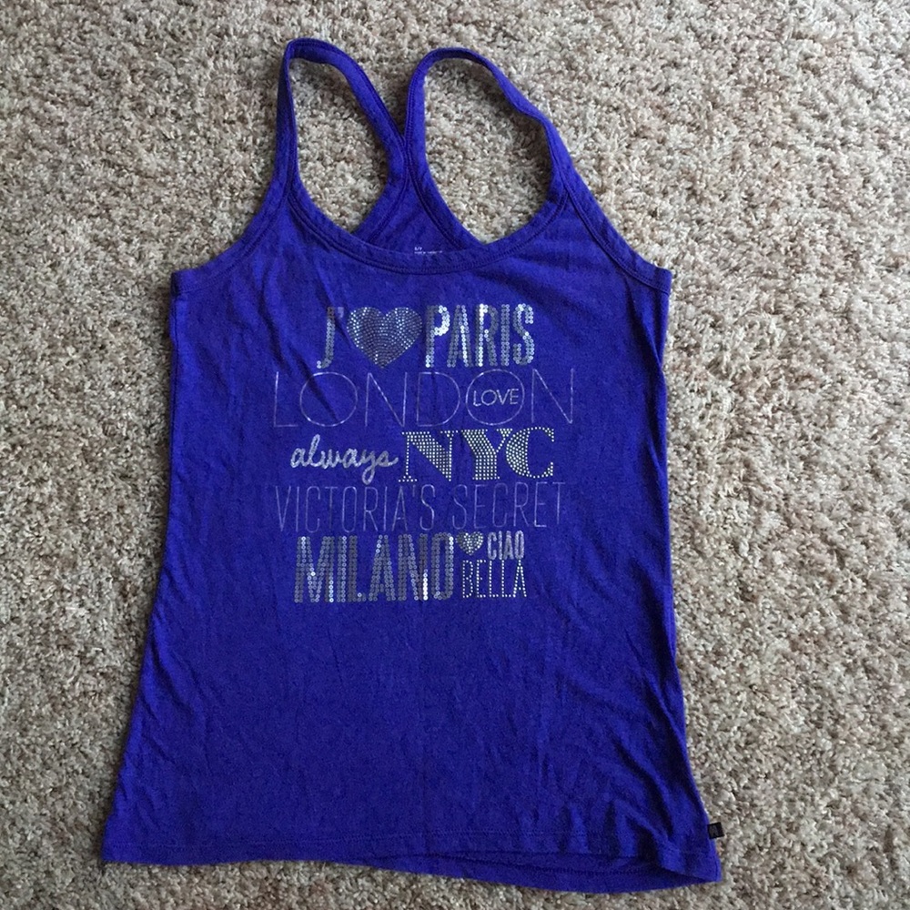 A purple tank top with silver sequins